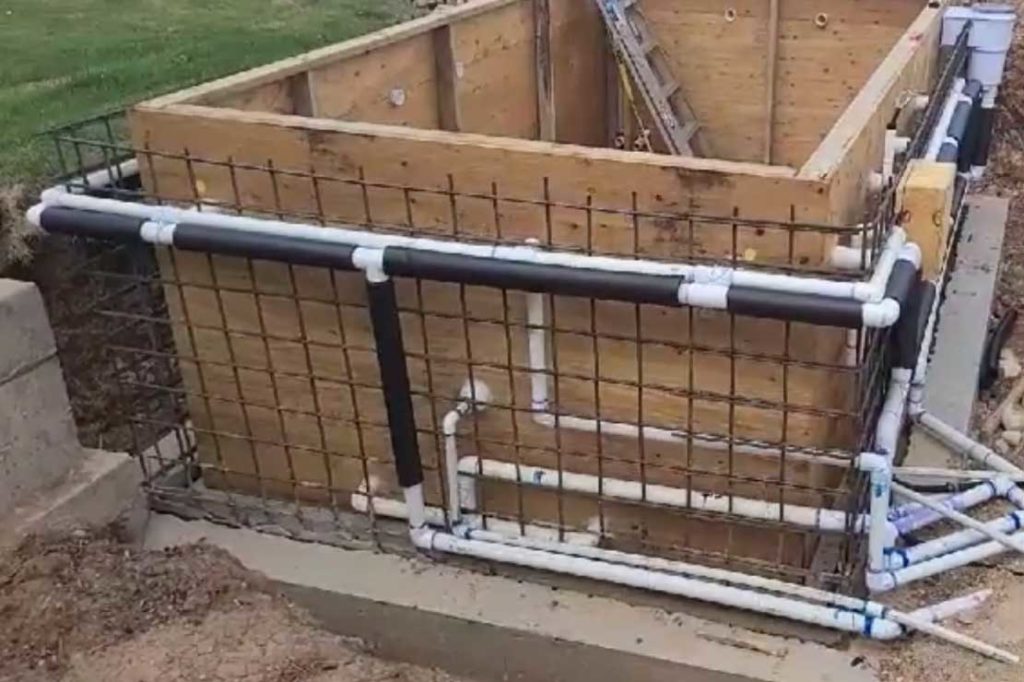 Hot tub plumbing tied to the rebar inside the formwork before the concrete pour