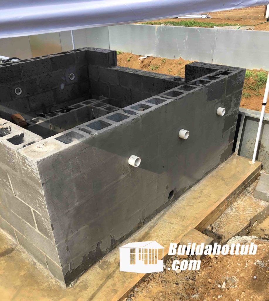 Gunite jet bodies set into Danny's block hot tub wall