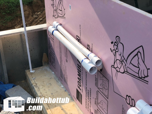 External hot tub plumbing feeding the jets