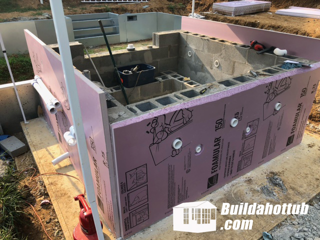 Air and water lines plumbed around the outside of Danny's hot tub