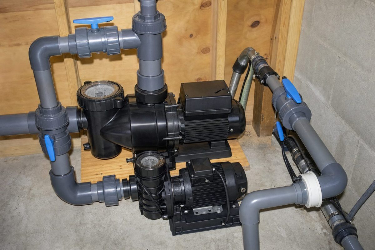 Two hot tub pumps with unions and gate valves in a DIY hot tub equipment room